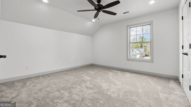 additional living space with light carpet, lofted ceiling, and ceiling fan