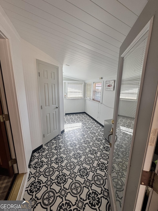 corridor with vaulted ceiling