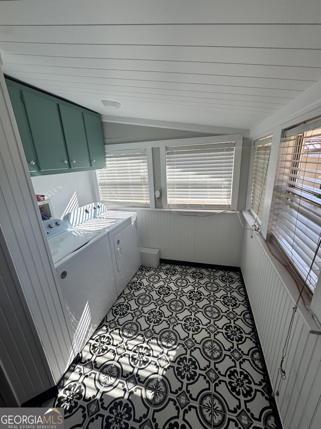 laundry room featuring cabinets and separate washer and dryer