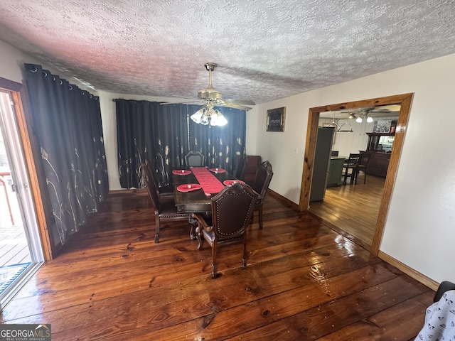 dining area with dark hardwood / wood-style flooring, a textured ceiling, and ceiling fan