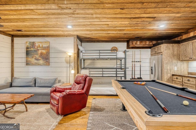 recreation room featuring billiards, light hardwood / wood-style flooring, wooden ceiling, and wooden walls