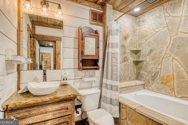 full bathroom featuring vanity, shower / bath combination with curtain, and toilet