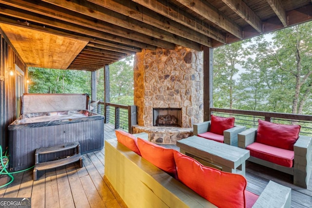 wooden deck featuring an outdoor living space with a fireplace