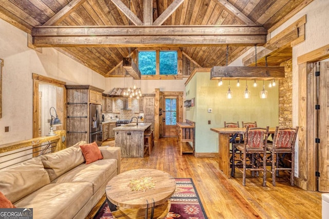 living room featuring high vaulted ceiling, wood ceiling, light hardwood / wood-style floors, and beamed ceiling