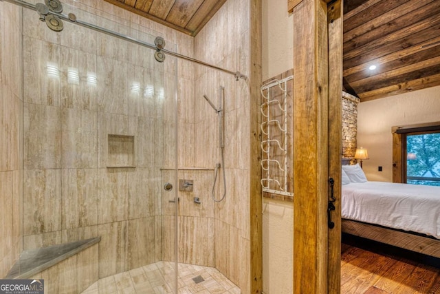 bathroom with an enclosed shower and wooden ceiling