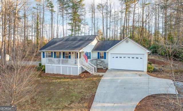 single story home featuring a garage and a porch