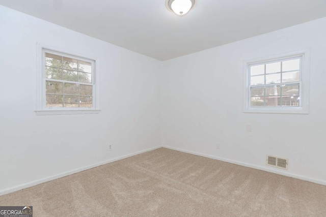 unfurnished room featuring carpet flooring