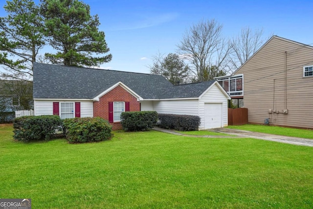 view of front of home with a garage and a front yard