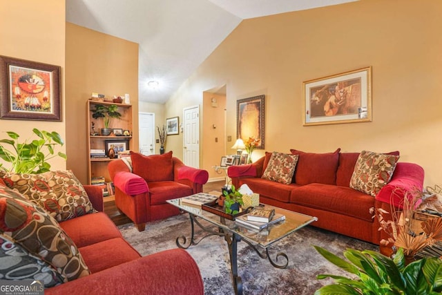 living room featuring lofted ceiling