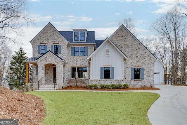 view of front facade featuring a garage and a front lawn