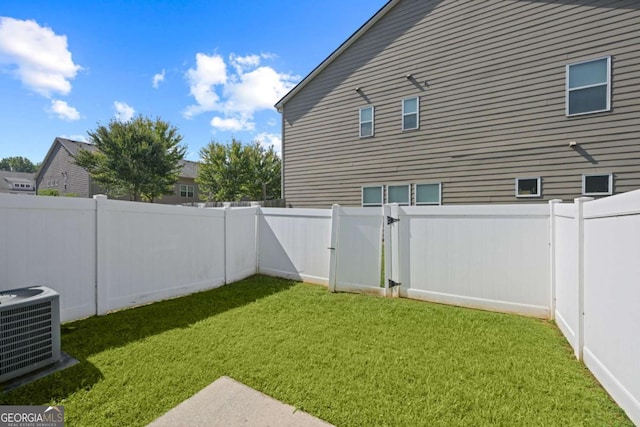 view of yard with central AC