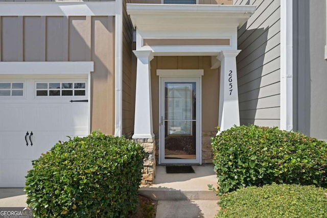 view of exterior entry featuring a garage