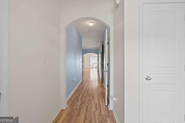 hall with light hardwood / wood-style floors