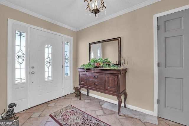 entrance foyer featuring crown molding and an inviting chandelier