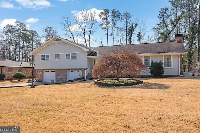 view of front facade with a garage and a front yard