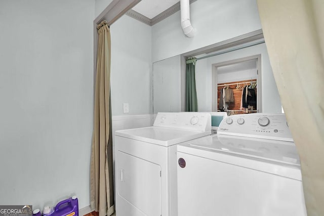 laundry area featuring washing machine and clothes dryer