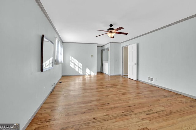 spare room with crown molding, ceiling fan, and light hardwood / wood-style floors