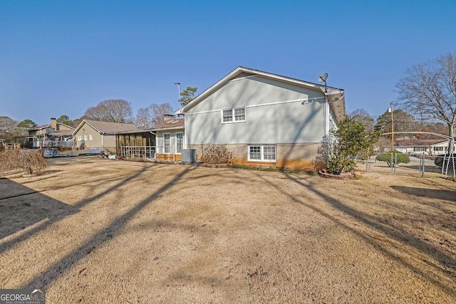 rear view of house with central AC