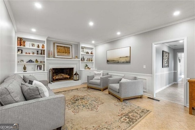 living room with crown molding, light tile patterned floors, and built in features