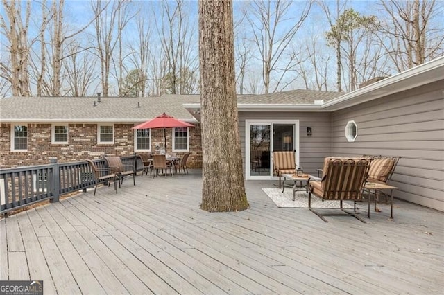 wooden deck featuring outdoor lounge area