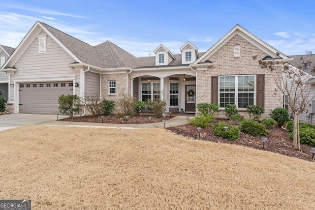 view of front of property with a garage and a front lawn