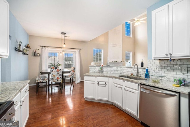 kitchen featuring white cabinetry, appliances with stainless steel finishes, decorative light fixtures, and sink