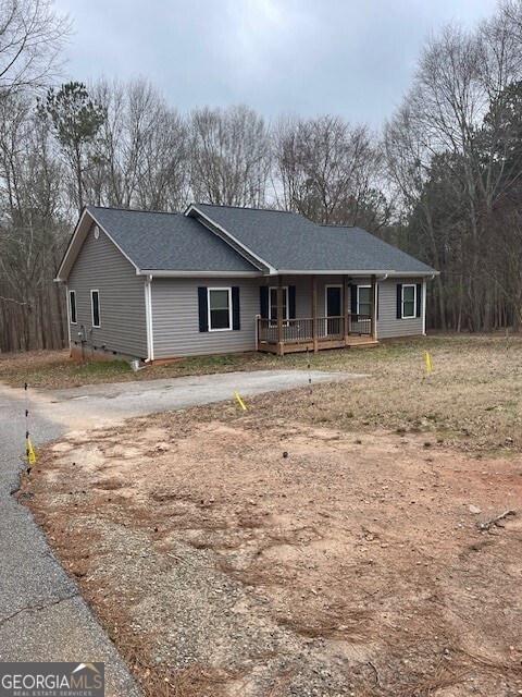 ranch-style home with covered porch