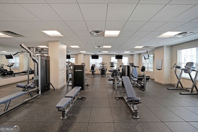 workout area featuring a paneled ceiling