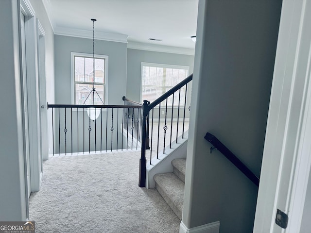 staircase with carpet, visible vents, crown molding, and baseboards