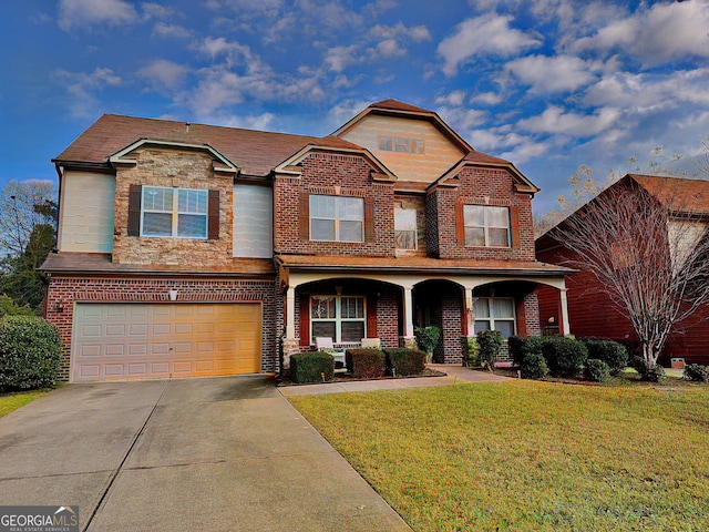 view of front facade with concrete driveway, an attached garage, covered porch, a front yard, and brick siding