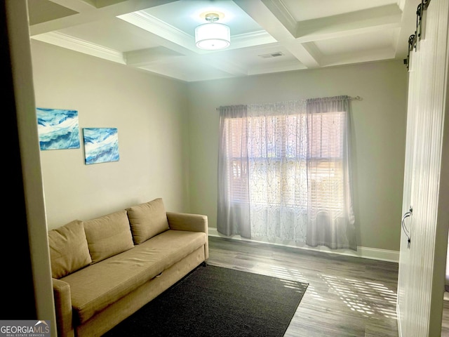 living area with a barn door, baseboards, coffered ceiling, wood finished floors, and beam ceiling