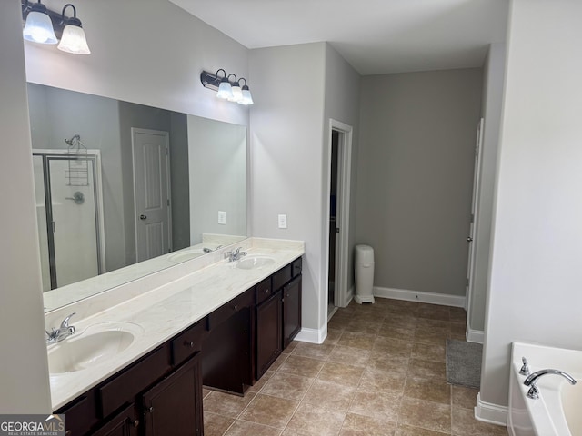 full bathroom featuring a stall shower, a garden tub, a sink, and double vanity