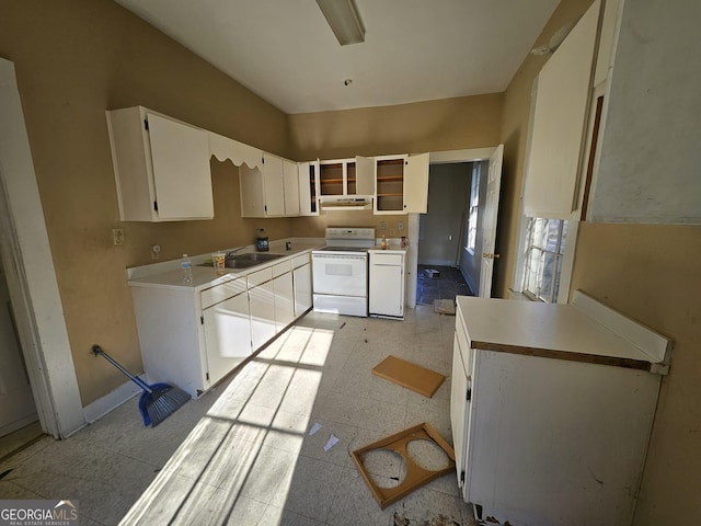 kitchen with white cabinetry, sink, and electric range