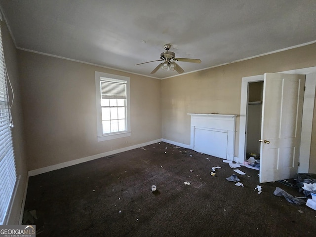 unfurnished bedroom with ceiling fan and ornamental molding