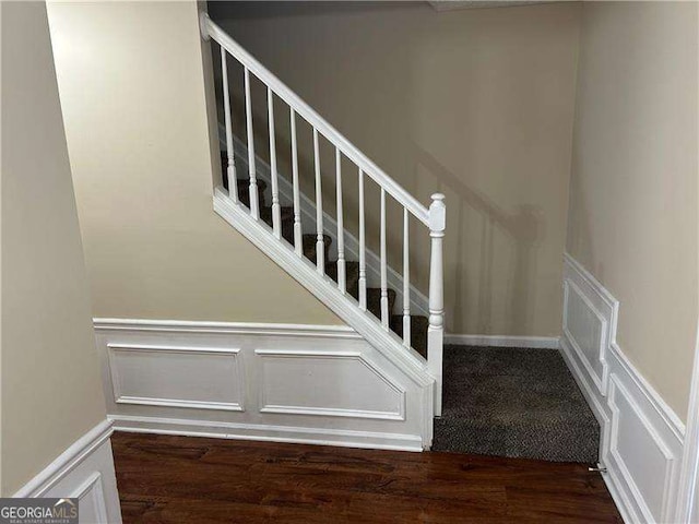 stairway with wood-type flooring