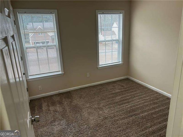 empty room featuring carpet flooring