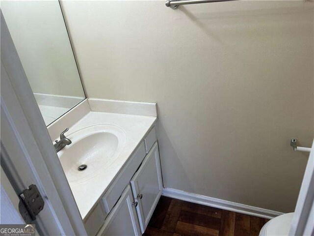 bathroom with vanity and toilet