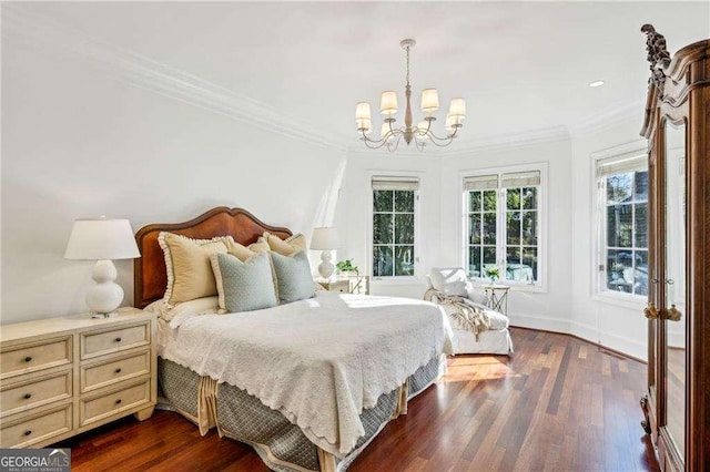 bedroom featuring an inviting chandelier, dark wood-type flooring, and ornamental molding