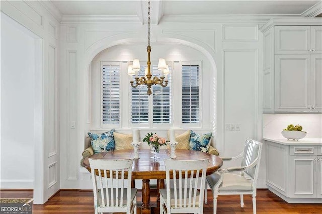 dining area with ornamental molding, dark hardwood / wood-style floors, a notable chandelier, and breakfast area