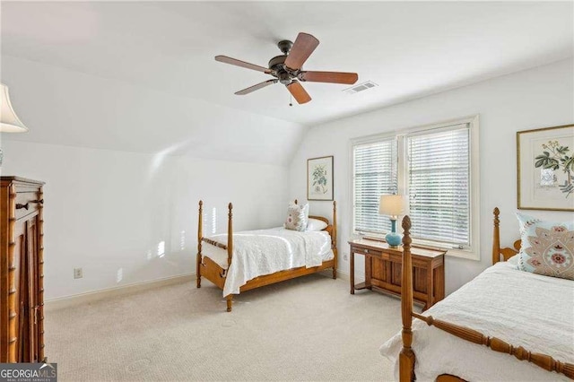 carpeted bedroom with lofted ceiling and ceiling fan