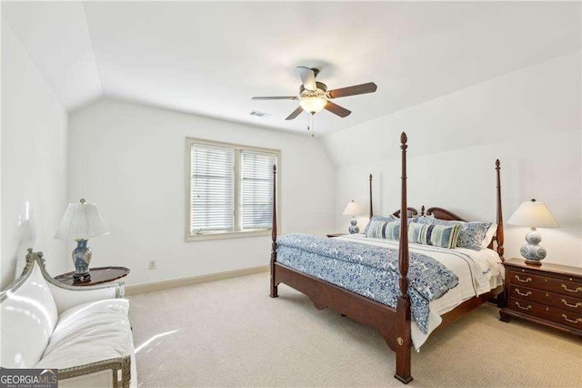 carpeted bedroom featuring lofted ceiling and ceiling fan