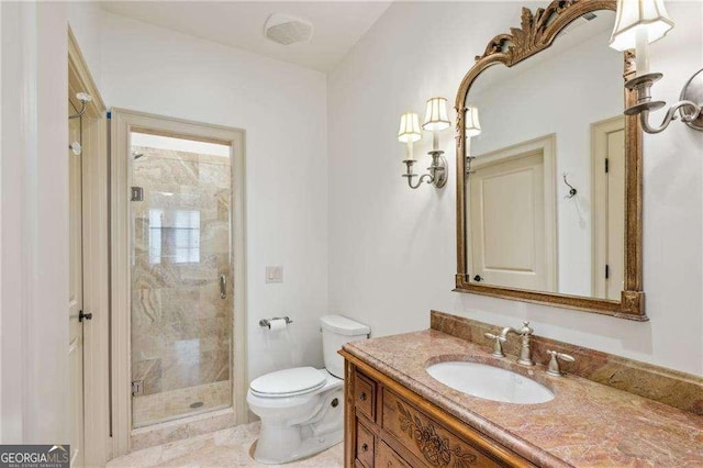 bathroom with toilet, vanity, and walk in shower