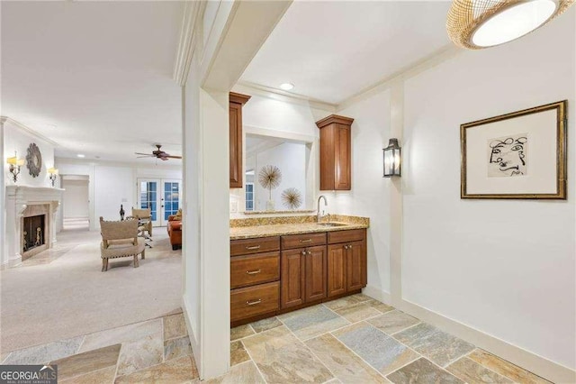 bathroom with vanity, ornamental molding, and ceiling fan