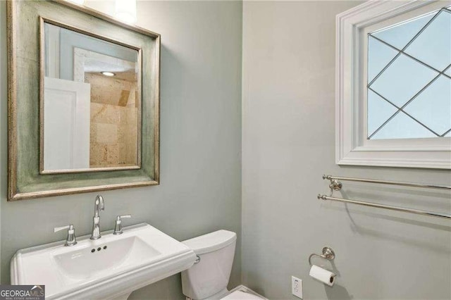 bathroom featuring sink and toilet