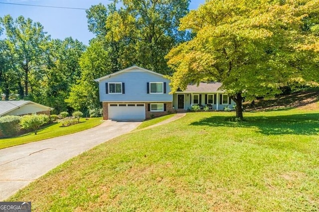 split level home featuring a garage and a front lawn