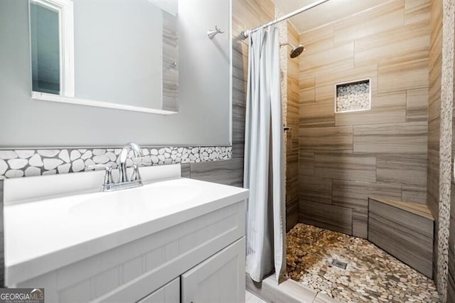 bathroom featuring vanity and a shower with shower curtain