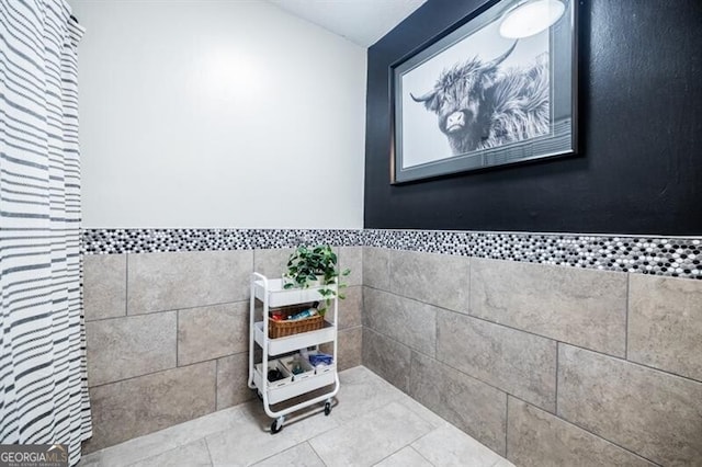 bathroom featuring tile walls and tile patterned floors