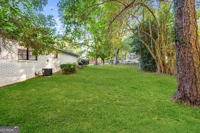 view of yard featuring central AC unit