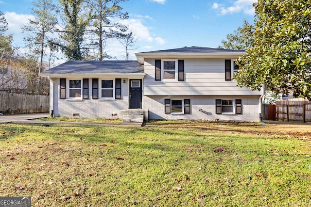 tri-level home with a front yard