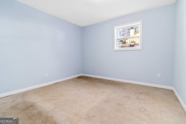 spare room featuring carpet